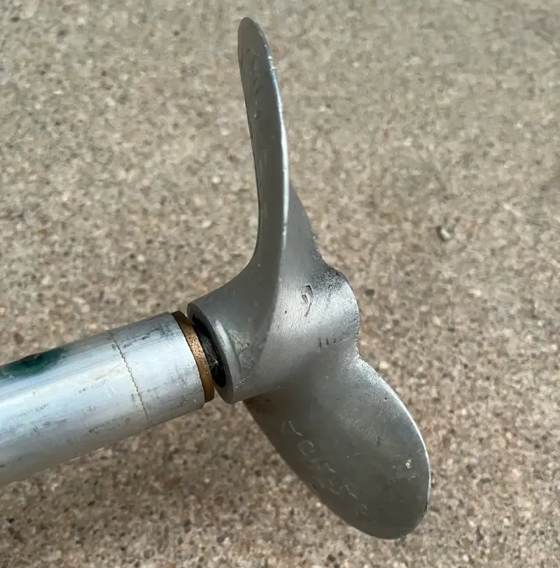 Homemade electric mud motor shaft with the prop and a hole drilled for grease.