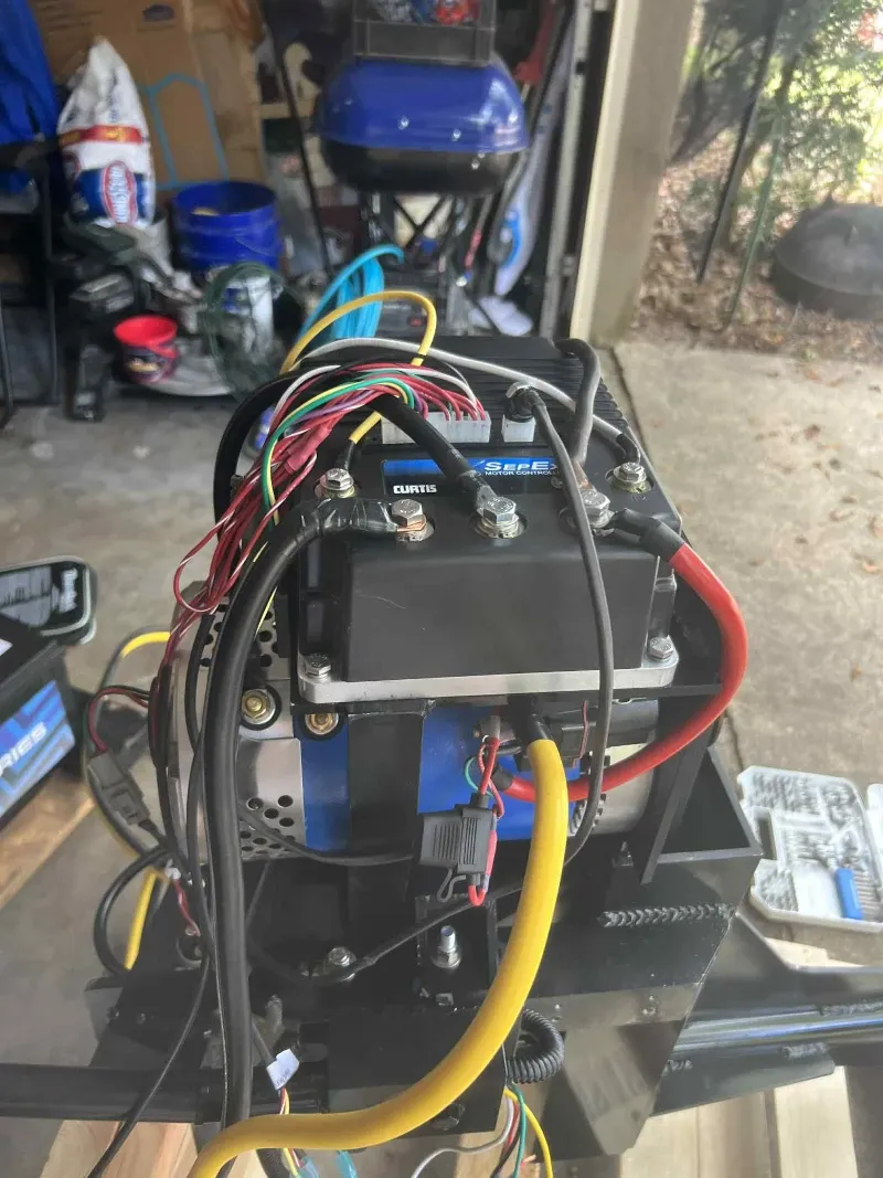 Electric mud motor surface drive with cover off showing the motor and controller.